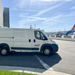 Redkey Express van driving at CVG airport.