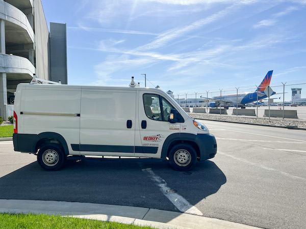 Redkey Express van driving at CVG airport.