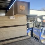 Redkey Express forlkift operator lifting stack of freight.